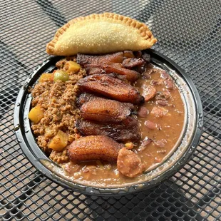 Piccadillo bowl and empanada.