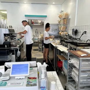 two people working in the kitchen