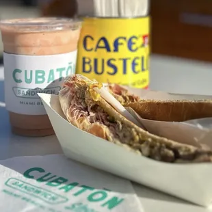 a cup of coffee and a sandwich