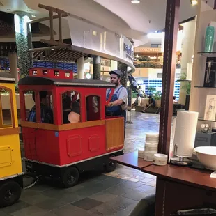 This conductor asked me for a tip before we boarded the train and I later saw him driving the train while looking down at his cellphone.