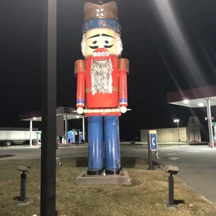 a giant nutcracker in a parking lot
