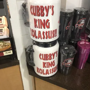 a stack of cups and a blender