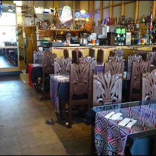 As you enter the restaurant, you'll notice the furniture is a combination of tables and booths, and the kitchen to the rear.