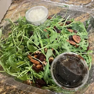 a salad in a plastic container