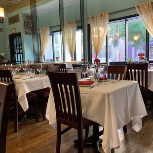 a dining room with tables and chairs