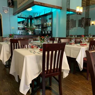 a dining room with tables and chairs