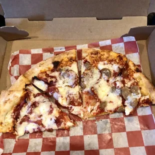 1/2 of a 12" inch sausage, pepperoni, and Canadian bacon pizza