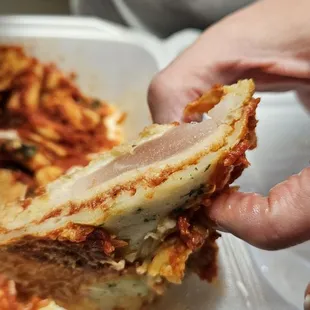 Raw Chicken Parmesan.  Be careful about what you eat here.