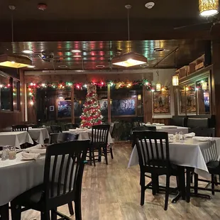a dining room with a christmas tree