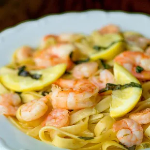 Shrimp Scampi sautéed in garlic, lemon-caper butter, basil &amp; white wine over fettuccine