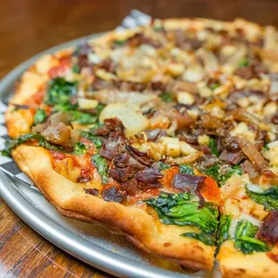 Build Your Own Pizza with flank steak, garlic, spinach and roasted onions