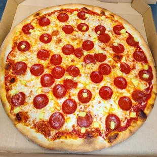 Pepperoni and pineapple pizza