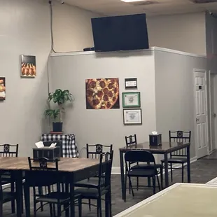 a dining area with tables and chairs