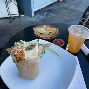 Pork Chile verdi burrito on the patio. You can&apos;t see the 3 big dogs under the table.