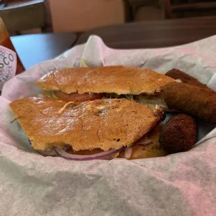 The Deluxe Sandwich and tostones (chicken and ham)