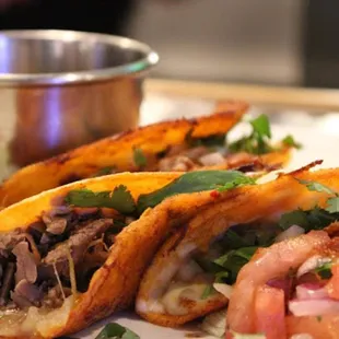 two tacoss on a plate