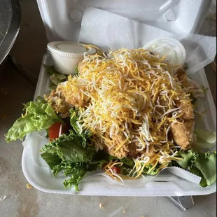 a chicken salad in a styrofoam container