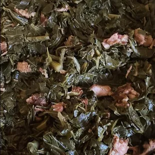 a bowl of greens and bacon