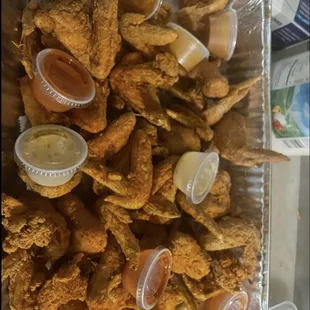 a tray full of fried chicken