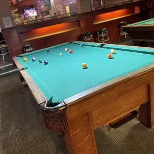 a pool table in a bar