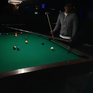 a man playing pool