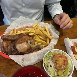 Rotisserie chicken with salad, French fries and yummy Peruvian sauces
