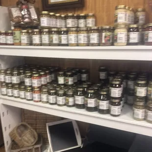 a shelf full of jars