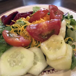 From the $8.99 lunch buffet: green salad with tomato, cucumber, and shredded cheddar. Oh, and a few slices of pickles beets.