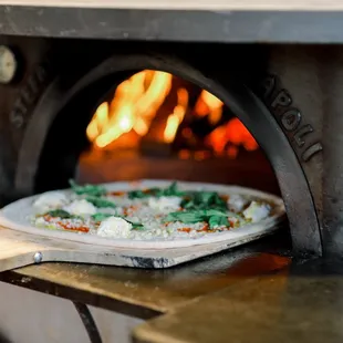 All of our pizzas are cooked to perfection in wood fired ovens which are imported from Italy.