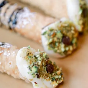 Fresh home made cannolis with pistachio and chocolate.