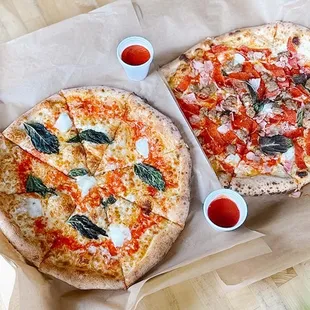 two pizzas on a table