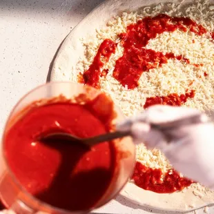 a pizza being prepared