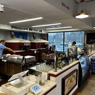 The counter at Cugino Forno. Somewhat full with customers at 2:15pm.