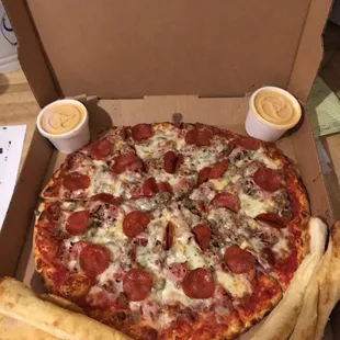 Got this meat pizza extra pepperoni thin crust bread sticks for a $20 bill it's what we do check 1-2