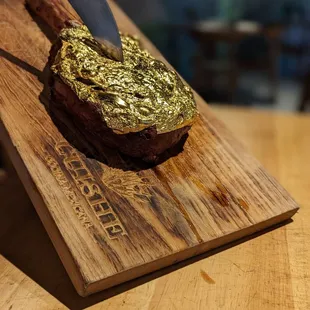 Gold encrusted tomahawk