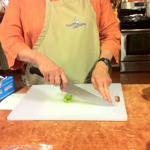 a woman chopping celery