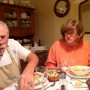 a man and woman sitting at a table