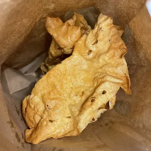 a piece of bread in a brown paper bag