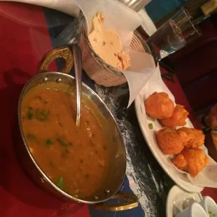 Tomato soup, Dal soup, and pakoras