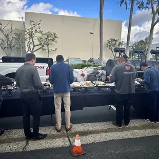 Anderson Howard team enjoying Cujo's Big Smoke BBQ.