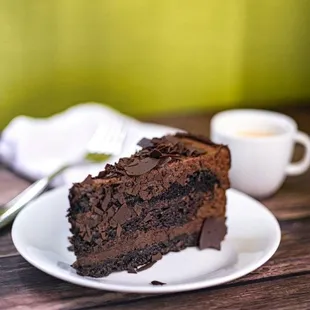 Chocolate Mousse Cake - Two-layer cake features a rich and decadent chocolate cake base covered with a thick layer of fluffy dark chocolate.