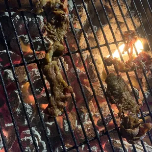 a grill with meat on it