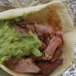 a burrito with guacamole