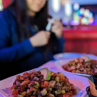 a woman taking a picture of her food