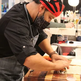 Chef Rodolfo rolling sushi