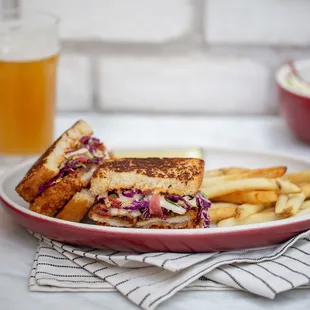 a grilled sandwich and french fries