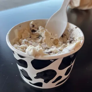 a person scooping into a bowl of ice cream