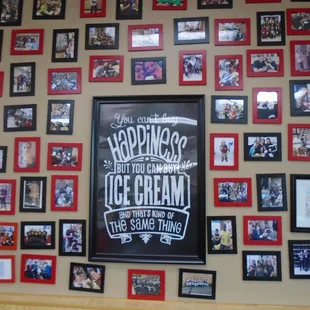 Wall full of customer photos.