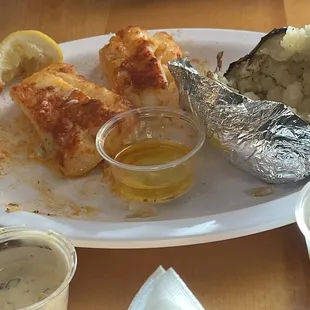 Baked fish with baked potato cole slaw and biscuits