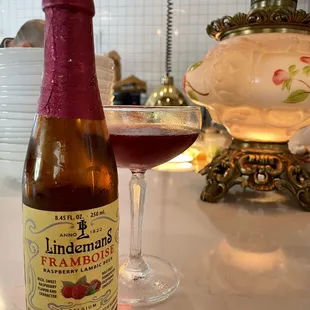a bottle and a glass of wine